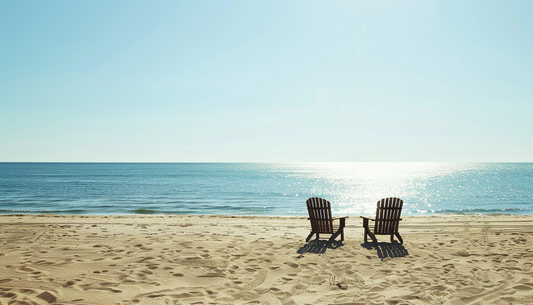 Beach chairs facing peaceful ocean representing retirement, longevity, and quality of life achieved through healthy aging practices
