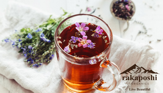 Cup of herbal tea on clean white table representing simple, natural wellness practices and hydration for health support