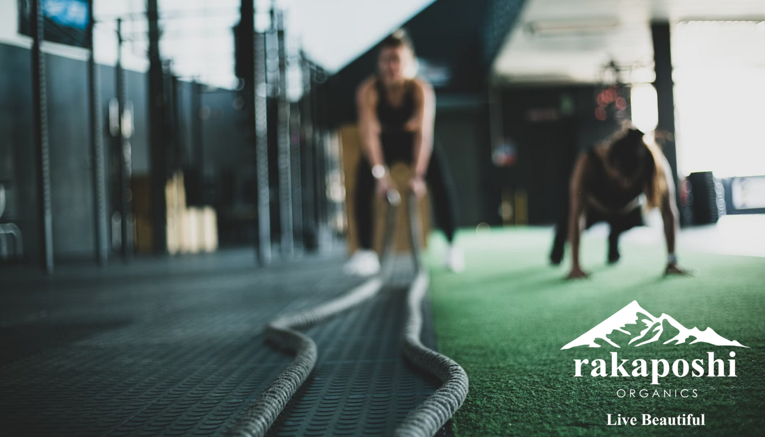 Athlete performing battle rope exercise demonstrating high-intensity training requiring proper recovery strategies