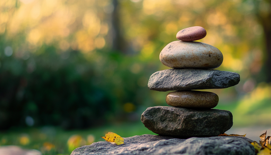 Balanced stack of zen stones representing harmony, natural cycles, and mindful living practices